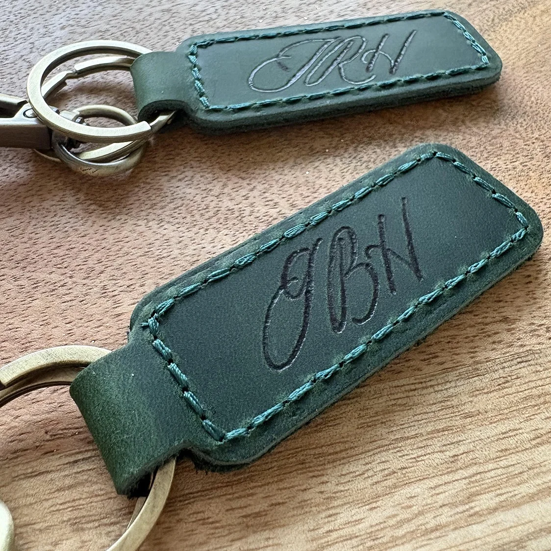 Sincerely1 Large Close-up of a personalized leather keychain with initials engraved by on-site calligraphy
